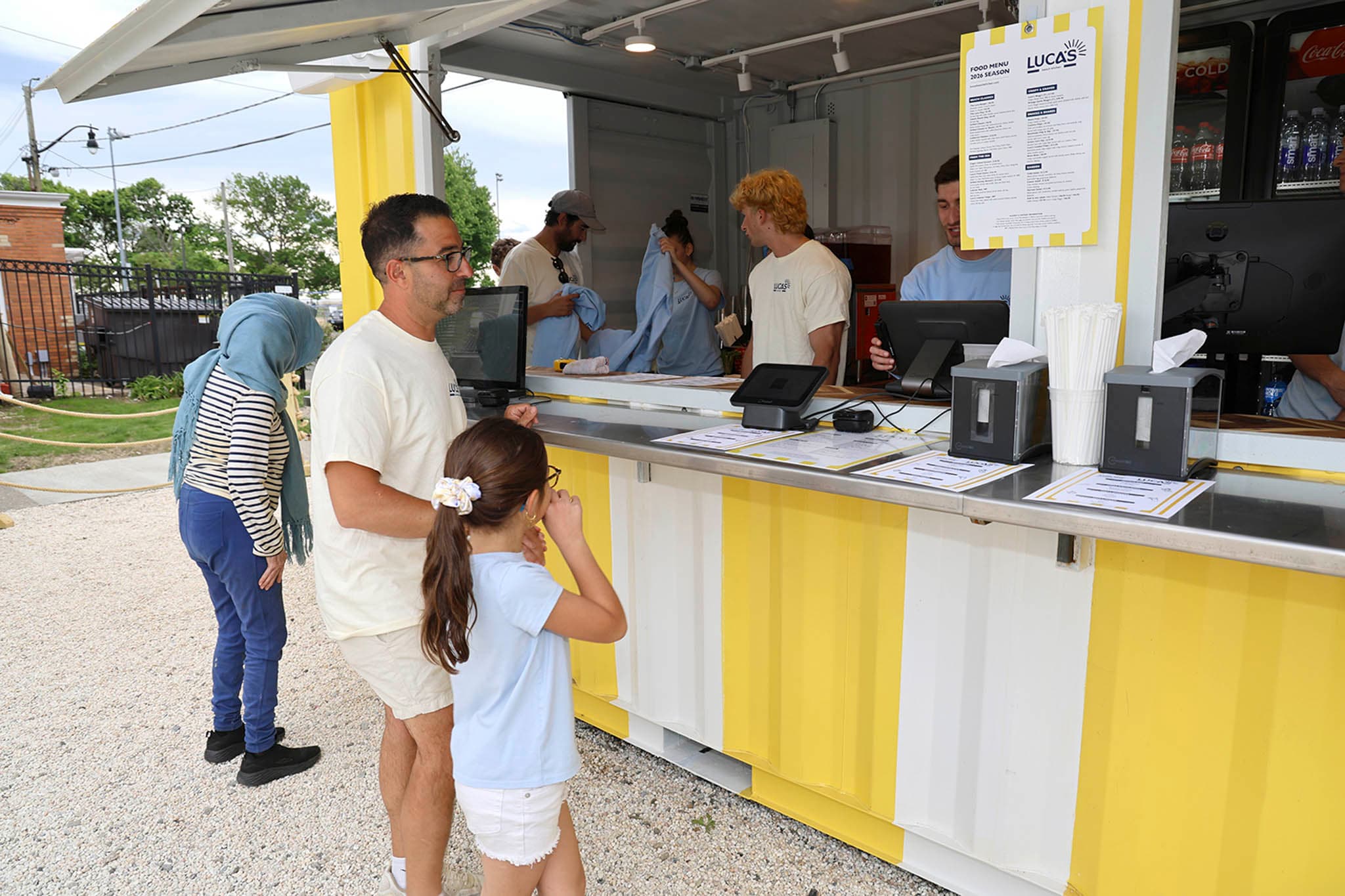Guests ordering at the Luca's Beach Kitchen counter